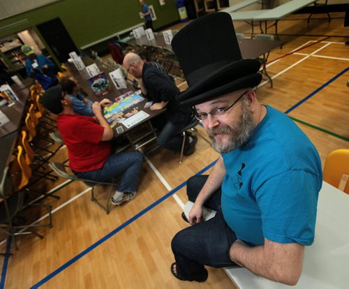 JimCon founder Jim Buchannan wears his trademark top hats at the Bronx Park Community Centre for the fifth annual gamers convention as the doors opened around 530 Friday. More than 500 individuals are expected to attend JimCon, Winnipegs tabletop games convention, this weekend. Attendees will be playing a variety of board, card, miniature and role-playing games. There are more than 500 board games available for anyone to play  on their own or as part of a scheduled session. There are also tournaments and demonstrations from local game designers. See Randy Turner story. November 13, 2015 - (Phil Hossack / Winnipeg Free Press)
