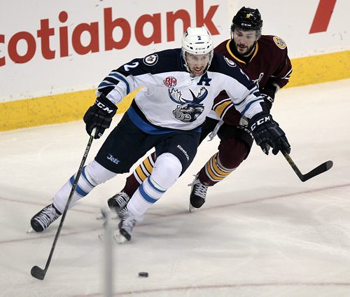 Winnipeg Moose #2Andrew MacWilliam drives out of the deep end with Chcago Wolves #9 Justin Hodgman in pursuit at the MTS Center Friday evening.  November 13, 2015 - (Phil Hossack / Winnipeg Free Press)