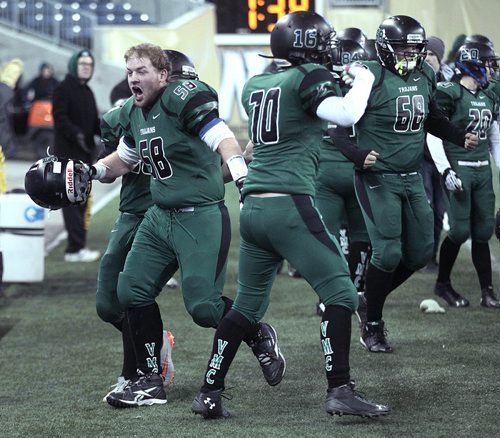Vincent Massey Trojan#58 Corin Plas celebrates as the team defeated St Pauls Crusaders at the Investor's Group Stadium Friday night. This is the first championship game for the team that was formed in 2009. See story.....November 13, 2015 - (Phil Hossack / Winnipeg Free Press)