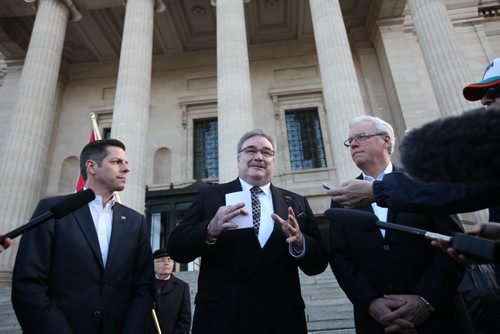 French Honourary Consul Bruno Burnichon passionately  speaks about the Paris attacks to the press concerned and concerned citizens who gathered on the steps of  the Manitoba legislature with Mayor Bowman, Premier Selinger on either side of him for vigil  Saturday afternoon.   Nov 14, 2015 Ruth Bonneville / Winnipeg Free Press