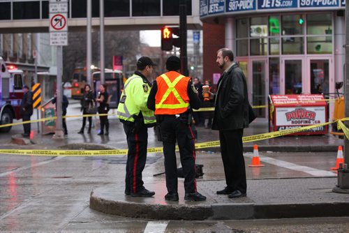 Police investigate the scene of a pedestrian truck mvc in front of the MTS Centre Monday morning at Portage Ave and Donald-Breaking NewsNov 16, 2015   (JOE BRYKSA / WINNIPEG FREE PRESS)
