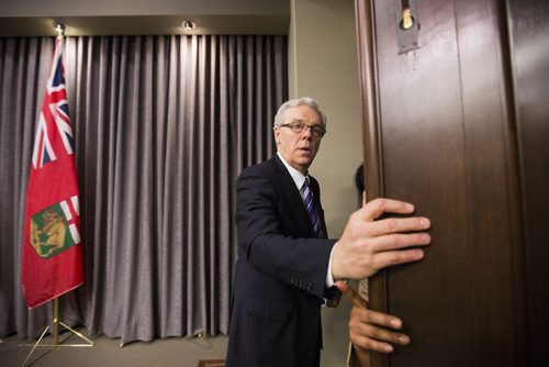 Premier Greg Selinger leaves the room after speaking at an embargoed news conference before the throne speech at the Manitoba Legislative Building in Winnipeg on Monday, Nov. 16, 2015.   (Mikaela MacKenzie/Winnipeg Free Press)