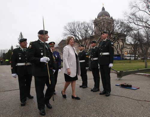 Canadian Forces 26th Field Artillery Regiment Captain Paul Haughey, left, from Brandon , Manitoba  leads Lieutenant Governor of Manitoba Janice C. Filmon on a tour of the troops after a 15 gun Vice Regal Salute at the Manitoba Legislature Monday to mark the throne speech  Nov 16, 2015   (JOE BRYKSA / WINNIPEG FREE PRESS)