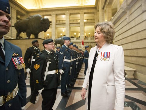 Lieutenant Governor of Manitoba Janice Filmon inspects the ranks at the Manitoba Legislative Building before the throne speech in Winnipeg on Monday, Nov. 16, 2015.   (Mikaela MacKenzie/Winnipeg Free Press)