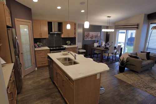 NEW HOME - 11 Cotswold Place in River Park South. Kitchen and eating area behind.  BORIS MINKEVICH / WINNIPEG FREE PRESS  NOV 16, 2015