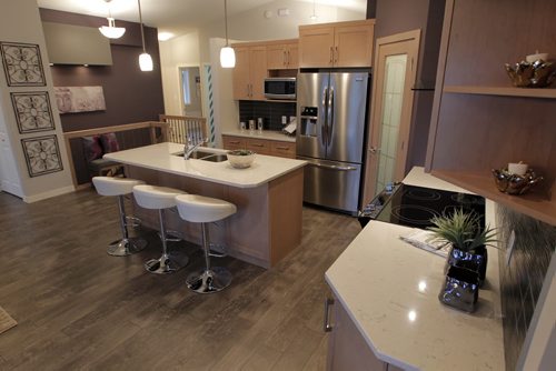 NEW HOME - 11 Cotswold Place in River Park South. Kitchen showing functional island. BORIS MINKEVICH / WINNIPEG FREE PRESS  NOV 16, 2015