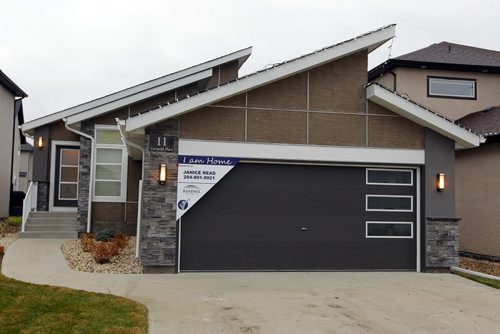 NEW HOME - 11 Cotswold Place in River Park South. Roof angles are modern and impressive. BORIS MINKEVICH / WINNIPEG FREE PRESS  NOV 16, 2015