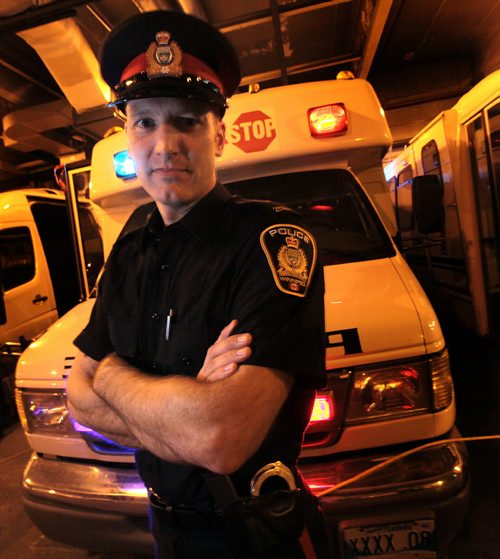Cst. Stephane Fontaine the WPSs Impaired Driving Counter Measures Coordinator poses in front to the Check Stop Van Monday. He spoke to Gord S. re: Testing for marijuana impairment. See Gord Sinclair story. November 16, 2015 - (Phil Hossack / Winnipeg Free Press)