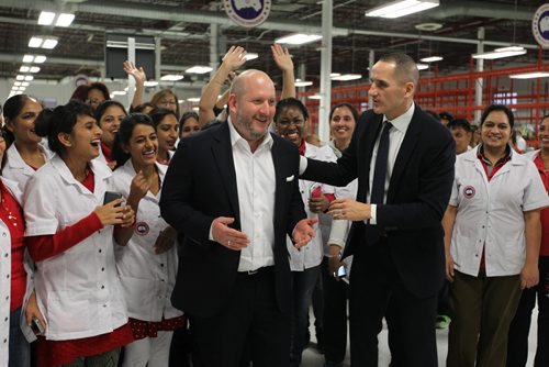 Dani Reiss CEO of Canada Goose (left) and Kevin Chief, Minister of Jobs and Economy, celebrate the opening of their new facility on Mountain Ave. Tuesday with their staff.    Nov 17, 2015 Ruth Bonneville / Winnipeg Free Press