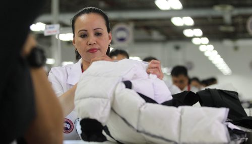 Canada Goose sewing operator, Alelie Sanvictores works  on sewing jackets with rows of other operators at their new facility on Mountain Ave. Tuesday.    Nov 17, 2015 Ruth Bonneville / Winnipeg Free Press