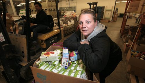 Winnipeg Harvest's Agency Hostess Lanna Diamond explains how the food bank keeps daycares's provisioned. See Randy Turner/  "Hunger Count" story. November 17, 2015 - (Phil Hossack / Winnipeg Free Press)