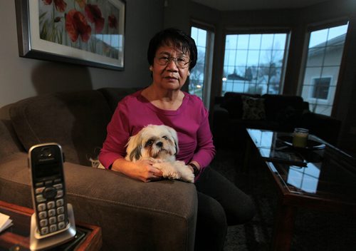 Monina Relano, who came to Canada from Philippines in 1969 and became a Cdn citizen in the 1970s, got a call from phone scammers yesterday claiming theyre with immigration and stating that she made a mistake on an immigration form. They said she had to send more  than $2,000 right away to settle out of court or the RCMP would arrest her and shed be taken to court, have to pay $80,000+ in legal costs and possibly be deported. She worries other newcomers will get sucked in by these slick willies. FOR SANDERS STORY  RUNNING THURSDAY November 18, 2015 - (Phil Hossack / Winnipeg Free Press)