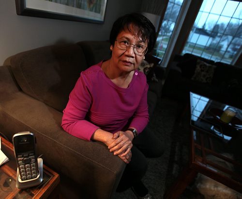 Monina Relano, who came to Canada from Philippines in 1969 and became a Cdn citizen in the 1970s, got a call from phone scammers yesterday claiming theyre with immigration and stating that she made a mistake on an immigration form. They said she had to send more  than $2,000 right away to settle out of court or the RCMP would arrest her and shed be taken to court, have to pay $80,000+ in legal costs and possibly be deported. She worries other newcomers will get sucked in by these slick willies. FOR SANDERS STORY  RUNNING THURSDAY November 18, 2015 - (Phil Hossack / Winnipeg Free Press)