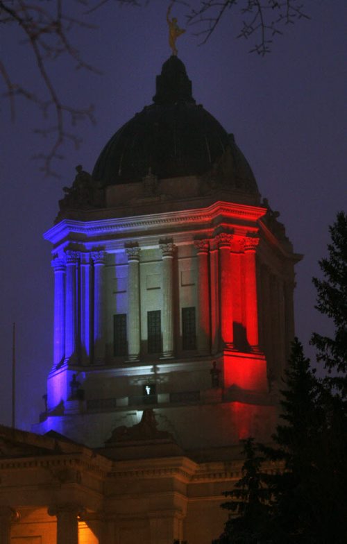 The Manitoba Legislature lit up in Frances colours to honour the victims of the recent terrorist attacks-Standup PhotoNov 19, 2015   (JOE BRYKSA / WINNIPEG FREE PRESS)
