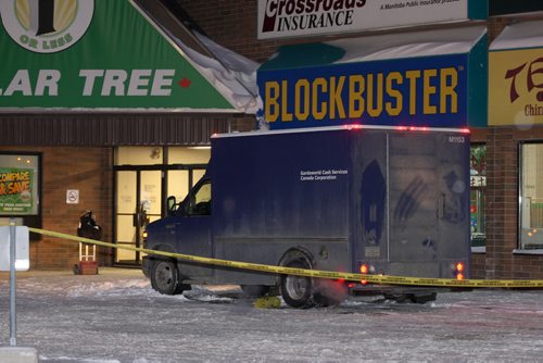 Winnipeg Police have tapped off a large portion of a parking lot at the Tyndall Market Mall on Keewatin-Inside the police tape is a armored car running near a entrance to the mall and a TD Canada Trust bank-See Bill Redekop storyNov 20, 2015   (JOE BRYKSA / WINNIPEG FREE PRESS)