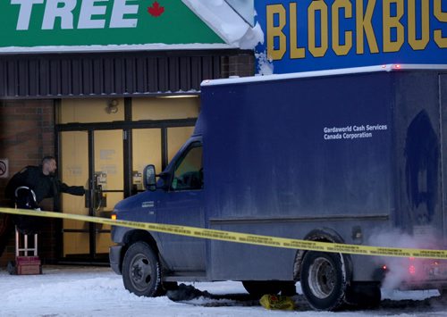 Winnipeg Police have tapped off a large portion of a parking lot at the Tyndall Market Mall on Keewatin-Inside the police tape is a armored car running near a entrance to the mall and a TD Canada Trust bank-See Bill Redekop storyNov 20, 2015   (JOE BRYKSA / WINNIPEG FREE PRESS)