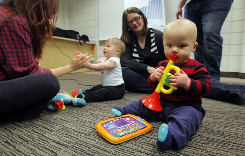 Four new child-care centres in schools as part of commitment to create 12,000 new spaces - Daycare kids press conference. Children, parents, and day care workers play around before Manitoba Govt. daycare announcement. Photo taken at Manitoba Institute of Trades and Technology (MITT). Left to right - Daycare worker (name not given), Owen, mother Vanessa Hildebrand, and Ryan. They are Vanessa's kids. BORIS MINKEVICH / WINNIPEG FREE PRESS  NOV 20, 2015