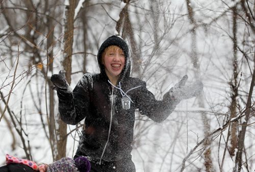 Fourteen-year-old Miriam Huebner has snow fights with a friends and family in the forest along Omands Creek Friday afternoon.   Standup photo Nov 20, 2015 Ruth Bonneville / Winnipeg Free Press