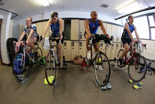 Amanda Lieverse and Lesley Ball, Robert Manswell, Marc Baldwin, all participating in an indoor triathlon at the Cindy Klassen Rec Centre, Saturday, November 21, 2015. (TREVOR HAGAN / WINNIPEG FREE PRESS)