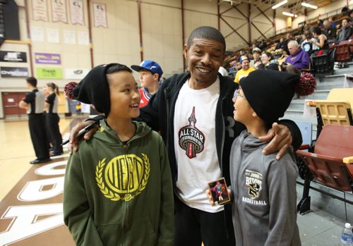 Former Toronto Raptor Muggsy Bogues signs autographs  and has his picture taken with Draiven Garcia - 11yrs (left) and his sister Memphis -10yrs (glasses) at U of M Saturday as part of the nationwide NBA All-Star 2016 program that will bring the excitement of All-Star to 14 Canadian cities in 10 provinces from November through February. Sports Standup photo Nov 21, 2015 Ruth Bonneville / Winnipeg Free Press