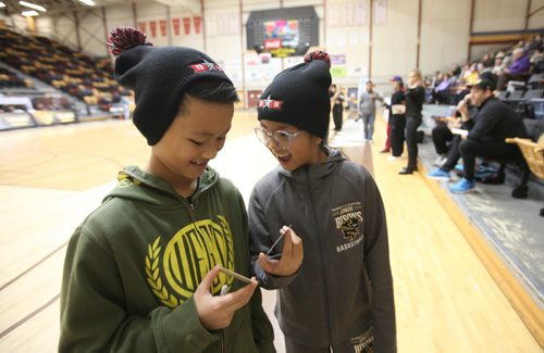 Draiven Garcia - 11yrs (left) and his sister Memphis -10yrs (glasses) show their excitement at having former Toronto Raptor Muggsy Bogues autograph while at the U of M Saturday as part of the nationwide NBA All-Star 2016 program that will bring the excitement of All-Star to 14 Canadian cities in 10 provinces from November through February. Sports Standup photo Nov 21, 2015 Ruth Bonneville / Winnipeg Free Press