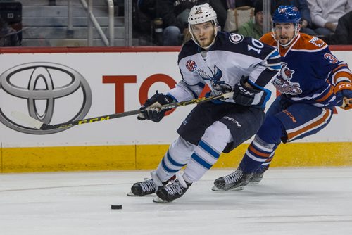 Manitoba Moose' Joel Armia (10) is chased by Bakersfield Condors' Anton Slepyshev (33) during first period AHL action at MTS Centre Sunday afternoon. 151122 - Sunday, November 22, 2015 -  MIKE DEAL / WINNIPEG FREE PRESS