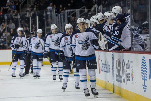 Manitoba Moose' JC Lipon (34) celebrates with teammates on the bench after scoring a goal against the Bakersfield Condors during first period AHL action at MTS Centre Sunday afternoon. 151122 - Sunday, November 22, 2015 -  MIKE DEAL / WINNIPEG FREE PRESS