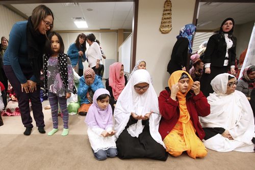 November 22, 2015 - 151122  -  Women pray at a prayer service during an open house at Winnipeg's Grand Mosque Sunday, November 22, 2015.  John Woods / Winnipeg Free Press