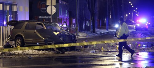 Winnipeg Police at the scene of a crash involving an SUV and a light standard on Portage Ave. and Good St. Monday morning. The crash closed the east bound lanes of Portage Ave. Bill Redekop story.  Wayne Glowacki / Winnipeg Free Press Nov. 23   2015