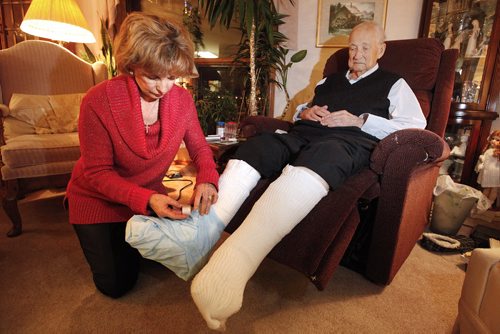 November 23, 2015 - 151123  -  Sharon Jarzombek is photographed with her father Bert Friesen who was injured when a Concordia Hospital nurse ripped four EKG connections from his legs Monday, November 23, 2015. John Woods / Winnipeg Free Press