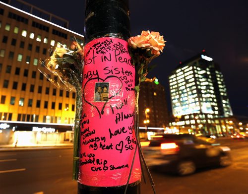 A memorial was placed on a pole on Portage Ave. at Good St., the scene of SUV crash Monday morning.  Wayne Glowacki / Winnipeg Free Press Nov. 24   2015