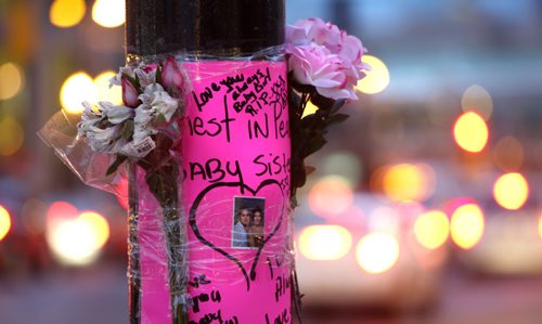 A memorial was placed on a pole on Portage Ave. at Good St., the scene of SUV crash Monday morning.  Wayne Glowacki / Winnipeg Free Press Nov. 24   2015