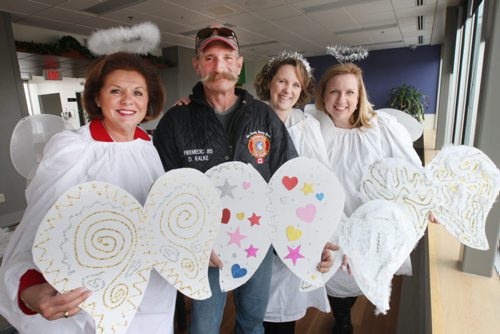 The foundation is having a world record attempt at largest gathering of angels on Dec. 1- L to R- Rosie Jacuzzi- Pres and CEO of Misericordia Health Centre, Darren Ralke, former Buhler Eye Care patient, Karen Woloschuk,Executive Director Misericordia Health Centre Foundation( MHCF), and Kim Siddall,MHCF board chair -See Kevin Rollason Philanthropy page storyNov 24, 2015   (JOE BRYKSA / WINNIPEG FREE PRESS)