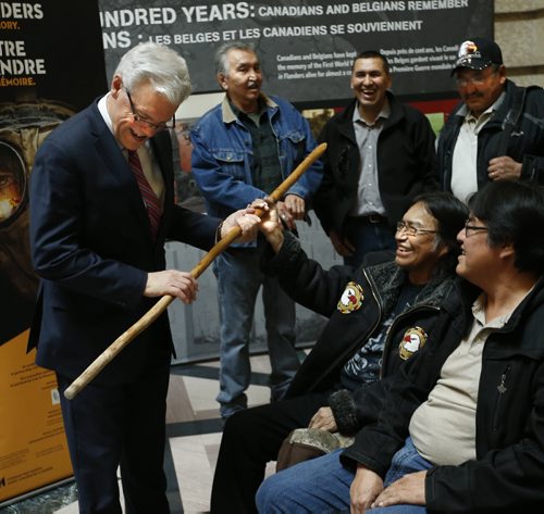 Premier Greg Selinger looks at Victor Harper's walking stick at the staircase in the Manitoba Legislative Bld. Tuesday before his First Nations land-use planning announcement. Mary Agnes Welch / Bart Kives stories  Wayne Glowacki / Winnipeg Free Press Nov. 24   2015