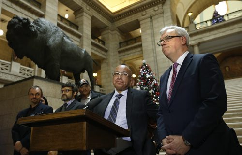 At right , Premier Greg Selinger and Chief Ron Evans of the Norway House Cree Nation at podium speak to media at the staircase in the Manitoba Legislative Bld. Tuesday re: First Nations land-use planning announcement. Mary Agnes Welch / Bart Kives stories  Wayne Glowacki / Winnipeg Free Press Nov. 24   2015
