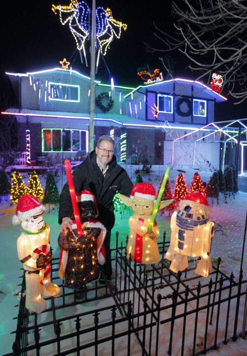 Michael Geiger-Wolf poses in front of his house at 18 Mildred Street. It's a fundraiser xmas christmas lights thing for cancer. BORIS MINKEVICH / WINNIPEG FREE PRESS  NOV 23, 2015