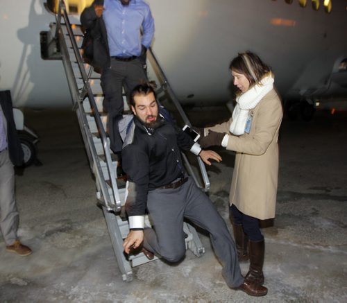 Several Ottawa RedBlacks took a spill as they stepped opff the plane. The plane parked right over an ice patch. The team arrives in Winnipeg on Tuesday, Nov. 24, 2015. The RedBlacks will play the Edmonton Eskimos in the 103rd Grey Cup on Sunday. BORIS MINKEVICH / WINNIPEG FREE PRESS  NOV 24, 2015. BORIS MINKEVICH / WINNIPEG FREE PRESS  NOV 24, 2015