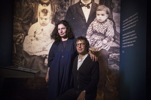 Canadian actor Arsinée Khanjian (left) and movie director Atom Egoyan pose by a display featuring Armenian refugees after speaking at the Canadian Museum of Human Rights in Winnipeg on Wednesday, Nov. 25, 2015.   (Mikaela MacKenzie/Winnipeg Free Press)