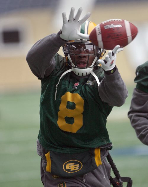 Edmonton Eskimos Cauchy Muamba keeps his eyes on the ball during a practice drill Wednesday afternoon in Winnipeg at Investors Group Field- The Eskimos will take on the Ottawa Redblacks this Sunday in the Grey Cup Championship-See Ed Tait storyNov 25, 2015   (JOE BRYKSA / WINNIPEG FREE PRESS)