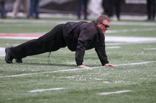 Edmonton Eskimos head coach Chris Jones has some fun during practice drill Wednesday afternoon in Winnipeg at Investors Group Field- The Eskimos will take on the Ottawa Redblacks this Sunday in the Grey Cup Championship-See Ed Tait storyNov 25, 2015   (JOE BRYKSA / WINNIPEG FREE PRESS)