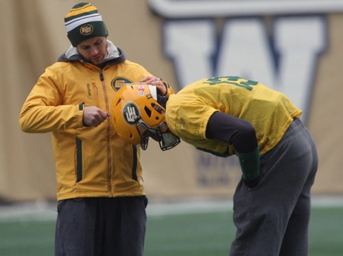 Edmonton Eskimos  pivot Mike Relly  gets a helmet adjustment at  Investors Group Field in Winnipeg Wednesday- The Eskimos will take on the Ottawa Redblacks this Sunday in the Grey Cup Championship-See Ed Tait storyNov 25, 2015   (JOE BRYKSA / WINNIPEG FREE PRESS)