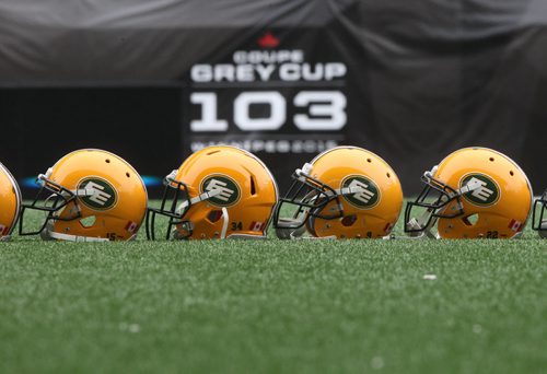 Edmonton Eskimos  helmets on   Investors Group Field in Winnipeg Wednesday during practice - The Eskimos will take on the Ottawa Redblacks this Sunday in the Grey Cup Championship-See Ed Tait storyNov 25, 2015   (JOE BRYKSA / WINNIPEG FREE PRESS)
