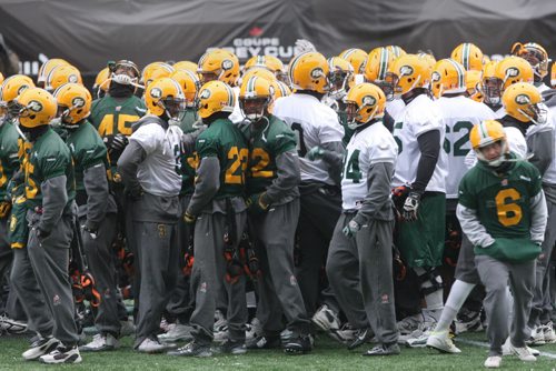 Edmonton Eskimos  players gather on   Investors Group Field in Winnipeg Wednesday during practice - The Eskimos will take on the Ottawa Redblacks this Sunday in the Grey Cup Championship-See Ed Tait storyNov 25, 2015   (JOE BRYKSA / WINNIPEG FREE PRESS)