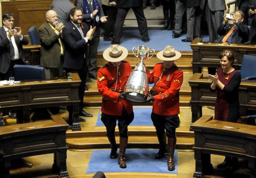 The CFL Grey Cup arrives at the Manitoba Legislature. It was marched into the chambers and saluted by the sitting house. BORIS MINKEVICH / WINNIPEG FREE PRESS  NOV 25, 2015