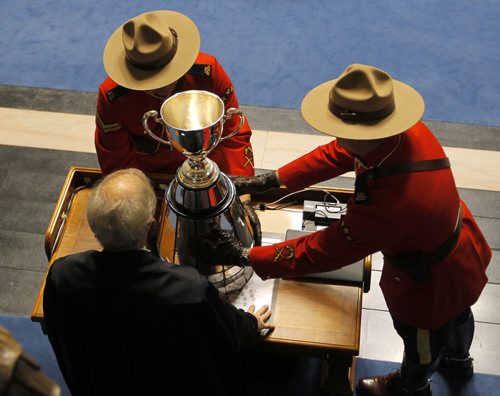 The CFL Grey Cup arrives at the Manitoba Legislature. It was marched into the chambers and saluted by the sitting house. BORIS MINKEVICH / WINNIPEG FREE PRESS  NOV 25, 2015