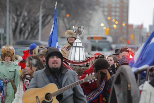 Brayden Anderson carries the Grey Cup to the Manitoba Legislative Building on a Red River Cart for the kickoff to Grey Cup festivities in Winnipeg, Man.. BORIS MINKEVICH / WINNIPEG FREE PRESS  NOV 25, 2015