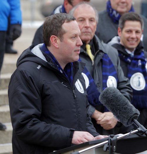 The CFL Grey Cup arrives at the Manitoba Legislature by Red River Cart. Metis and Aboriginal paraded the cup to the Leg in an official event. Here Grey Cup festival's Jason Smith addresses the crowd. BORIS MINKEVICH / WINNIPEG FREE PRESS  NOV 25, 2015