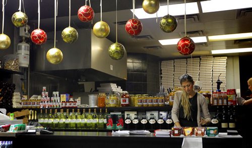 THIS CITY - Santa Ana Pizzeria & Bistro. Server Chelsey Palmer prepares for some customers at the nicely decorated front lobby. BORIS MINKEVICH / WINNIPEG FREE PRESS  NOV 25, 2015