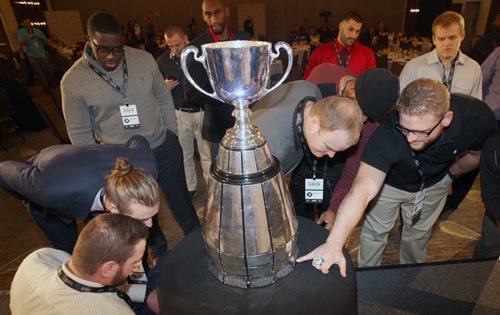 Ottawa Redblacks playersgather to have a look at the Grey Cup  at the Grey Cup East Division Champions Media Breakfast at the Delta Hotel in downtown Winnipeg -See storyNov 26, 2015   (JOE BRYKSA / WINNIPEG FREE PRESS)