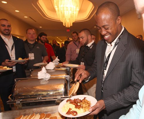 Ottawa Redblacks QB Henry Burris  , right,grabs some breakfast with teammates  at Grey Cup East Division Champions Media Breakfast at the Delta Hotel in downtown Winnipeg -See storyNov 26, 2015   (JOE BRYKSA / WINNIPEG FREE PRESS)